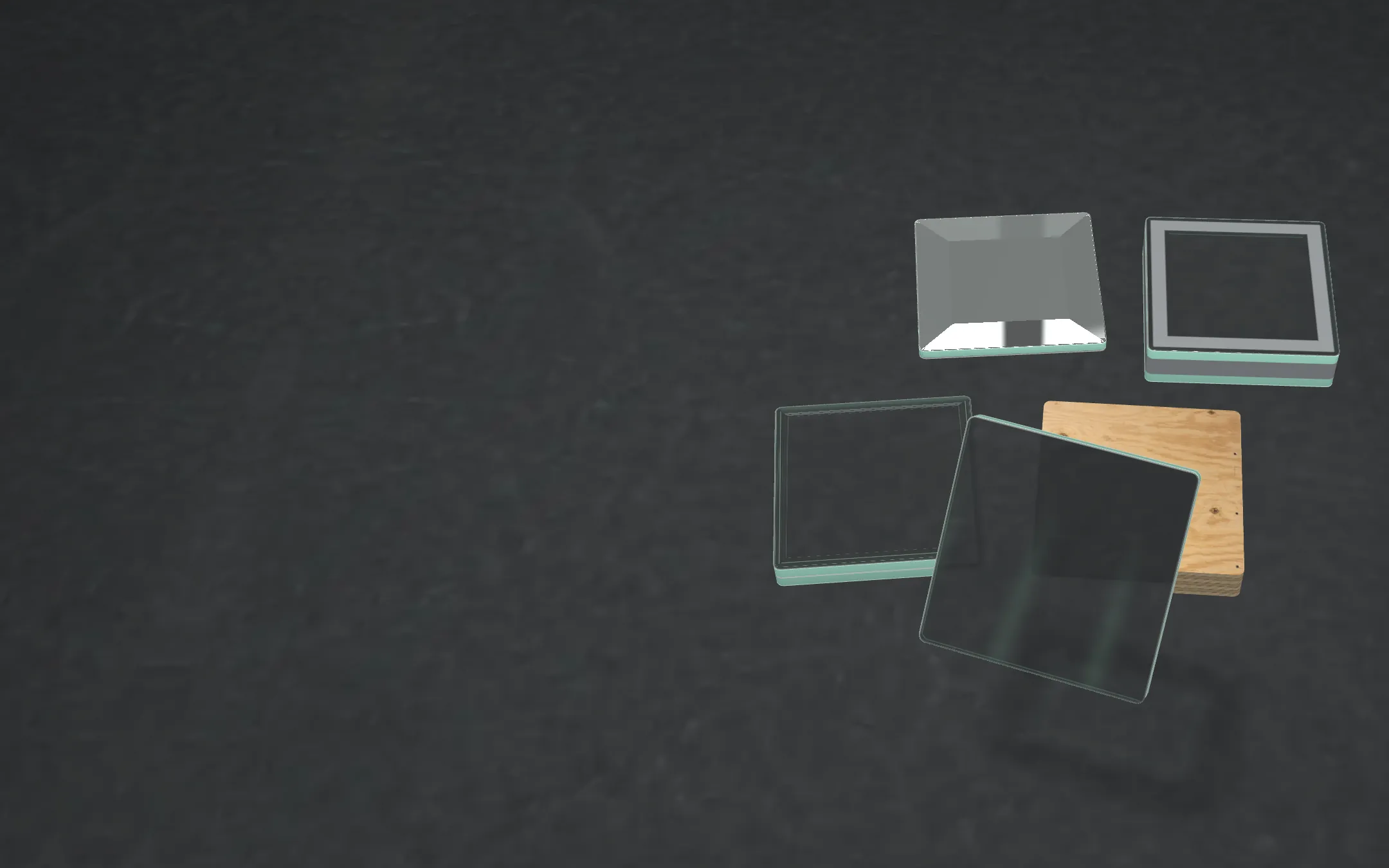 Five samples on a felt cutting table: shower glass, a mirror with a bevel, a double-pane window unit, thick storefront glass and a square of plywood.