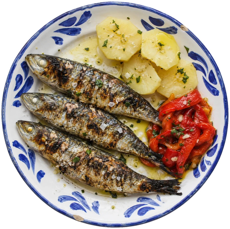 Three charcoal-grilled sardines on a blue and white plate, with boiled potatoes and roasted peppers